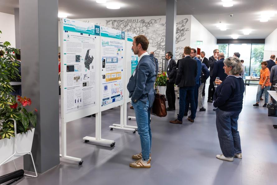 A person looks at a scientific poster 